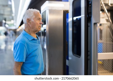 Elderly Man Getting On Modern Subway Car