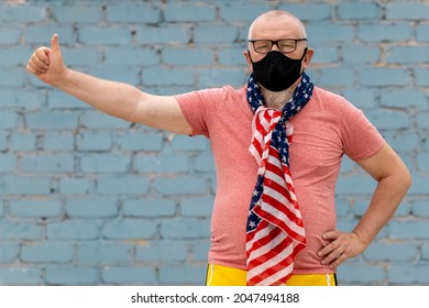 An Elderly Man With A Gray Beard And Glasses Tied An American Flag Bandana And A Black Mask. He's Overflowing With Emotion 