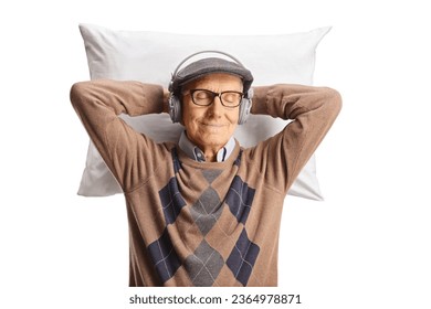 Elderly man with headphones resting on a pillow isolated on white background - Shutterstock ID 2364978871