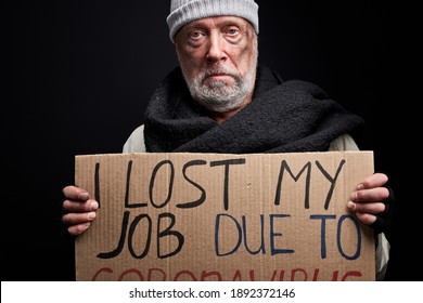 Elderly Man Lost His Job Due To Coronavirus, Looking At Camera Wearing Dirty Clothes Isolated On Black Background