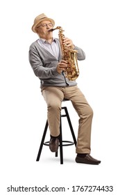 Elderly Man Musician Playing A Sax And Sitting On A Chair Isolated On White Background