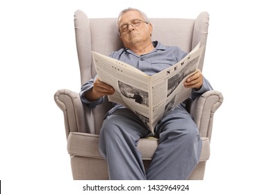 Elderly man with a newspaper sleeping in an armchair isolated on white background