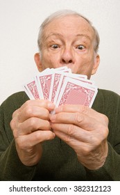 Elderly Man With Playing Cards