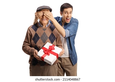 Elderly man with a present and a young man covering his eyes isolated on white background - Powered by Shutterstock