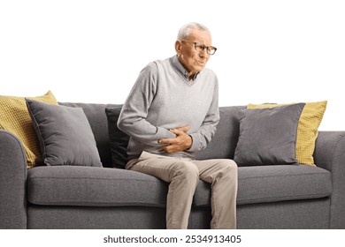 Elderly man sitting on sofa and suffering from stomach pain isolated on white background - Powered by Shutterstock