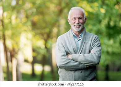 Elderly Man Smiling Outdoors In Nature 