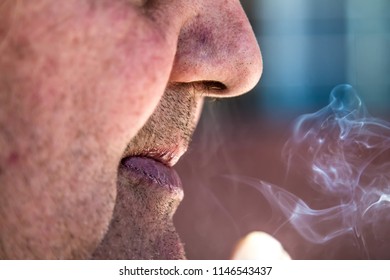 Elderly Man Smoking A Cigarette