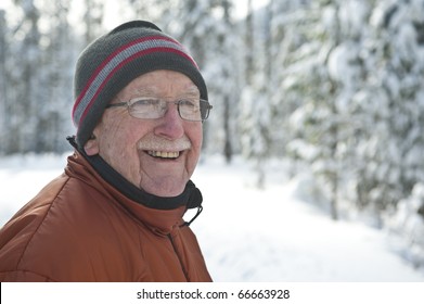 Elderly Man In Snowy Winter Scene