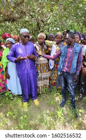 Elderly Man Speaking During A Meeting In Talto Djega-Saré Diallo Village, Kolda Region, Senegal, West Africa. October, 11, 2019. Community Of African People Discussing Together In The Countryside.  