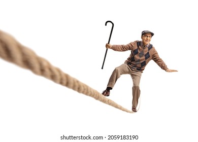 Elderly man standing on a rope and keeping balance isolated on white background