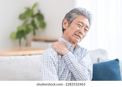 Elderly man with stiff shoulders - Powered by Shutterstock