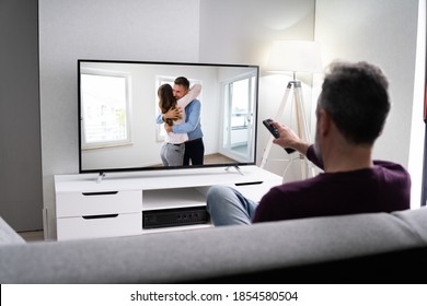 Elderly Man Streaming And Watching Movie On TV Screen