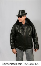 Elderly Man With Sunglasses, Hat And Black Leather Jacket