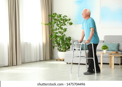 Elderly man using walking frame indoors. Space for text - Powered by Shutterstock