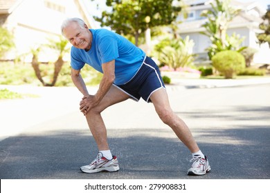 Elderly Man Warming Up For Run