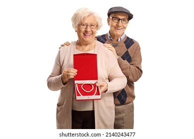 Elderly Man And Woman Holding A Box With A Pearl Necklace And Bracelet Isolated On White Background