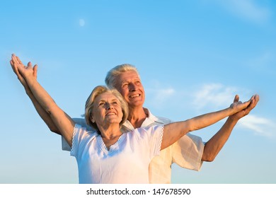 Elderly Man And An Elderly Woman Resting Together