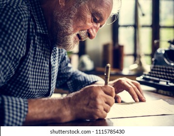 Elderly Man Writing A Letter