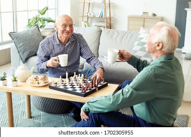 Elderly Men Playing Chess At Home