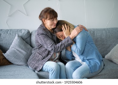 Elderly Mother Hug Crying Adult Daughter Show Support And Care , Supportive Senior Woman Embrace Cuddle Grownup Child Feeling Depressed, Having Life Problems