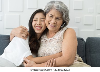 Elderly mum hugging grownup daughter at home. Close up happy older mature mother embracing young grownup daughter with kindly. Young woman carefully takes care of elder woman - Powered by Shutterstock