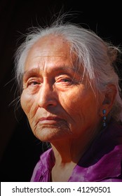 Elderly Navajo Woman With Light Shining On Her Face