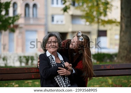 Similar – Image, Stock Photo two sisters laugh heartily on the street