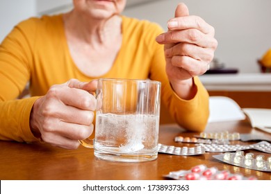 Elderly Old Person Taking Medication. Self Treatment Not Safe For People. Feeling Ill Call Hospital Doctor Professional. Close Up Hand With Glass Water Dissolve Tablet Aspirin Anti Inflammatory Drug.