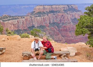 Elderly Overweight Couple Of Tourists In Grand Canyon, North Rim