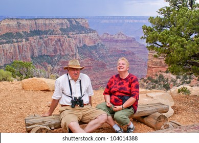 Elderly Overweight Couple Of Tourists In Grand Canyon, North Rim