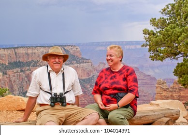 Elderly Overweight Couple Of Tourists In Grand Canyon, North Rim