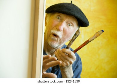 Elderly Painter Wearing A Beret Working On A Large Canvas And Looking Up