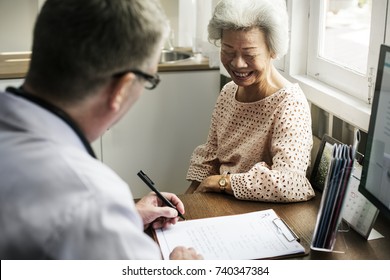 An Elderly Patient Meeting Doctor At The Hospital