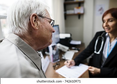 An Elderly Patient Meeting Doctor At The Hospital