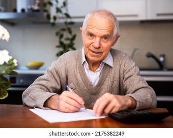 elderly pensioner writing on piece of paper - Powered by Shutterstock