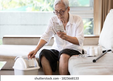 Elderly People Is Checking Expiration Date Or Deterioration Of Medication Before Use In The Treatment,senior Woman Reading Pill Label Before Taking Of Medicine And Throwing Expired Drug Into The Trash