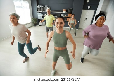 Elderly people dancing during training - Powered by Shutterstock