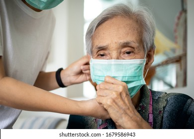 Elderly People Have Illness,fever And Cough,infectious Symptoms Of Flu,cold,pandemic Of Covid-19,female Caregiver Wearing Protective Mask To Sick Senior Woman,prevent Outbreak,spread Of Coronavirus