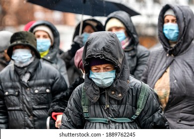 Elderly People In A Protective Masks Against Coronavirus Covid 19 On The Street In Kyiv, Ukraine. January 2021