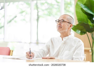 Elderly People Writing Sentences While Thinking