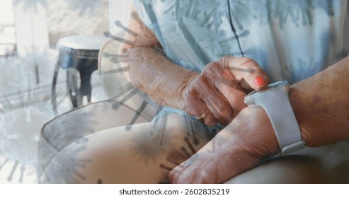 Elderly person checking smartwatch at home, focusing on health monitoring. Technology, wearable, innovation, wellness, senior, lifestyle - Powered by Shutterstock - Get 15% off with code: PIKWIZARD15