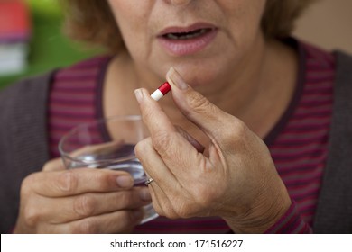 Elderly Person Taking Medication