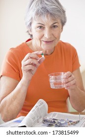 Elderly Person Taking Medication