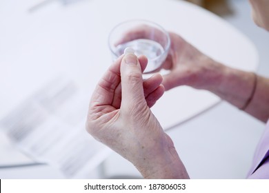 Elderly Person Taking Medication