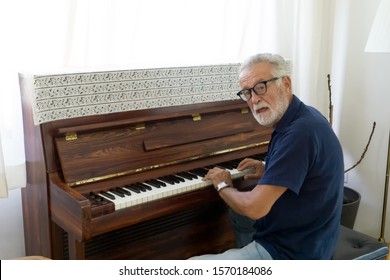 Elderly practice to play piano in house alone