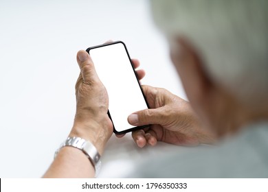 Elderly Senior Hand Using Cell Phone Or Smartphone