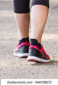 Elderly Senior Woman In Sporty Shoes Walking On Hiking Trail In Summer Park, Healthy Sporty Lifestyles In Old Age