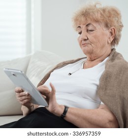 Elderly Smart Lady Using The Ipad