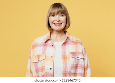 Elderly smiling cheerful fun cool satisfied positive blonde caucasian woman 50s years old she wear casual clothes looking camera isolated on plain yellow background studio portrait. Lifestyle concept - Shutterstock ID 2323467345