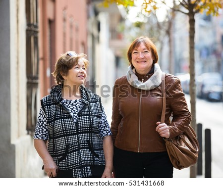 Image, Stock Photo two sisters laugh heartily on the street